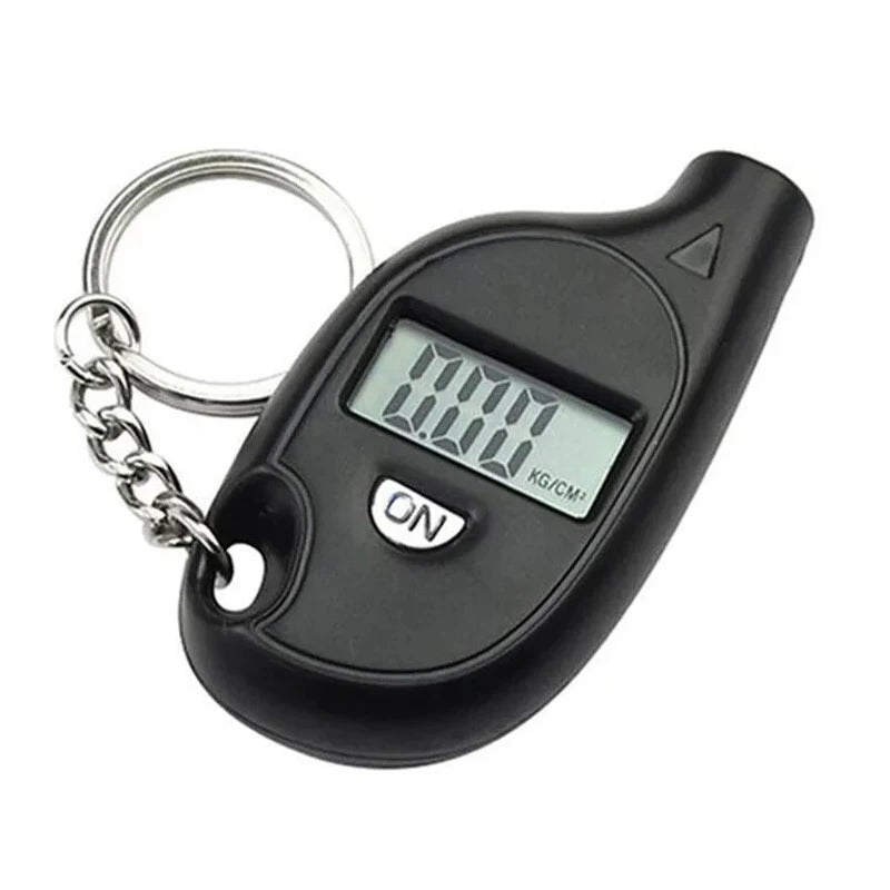 Black digital keychain scale with a digital display on a white background
