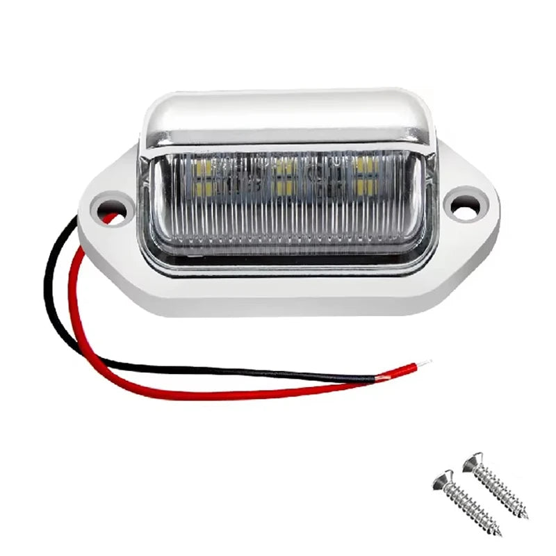Car license plate light with wiring and screws on a white background