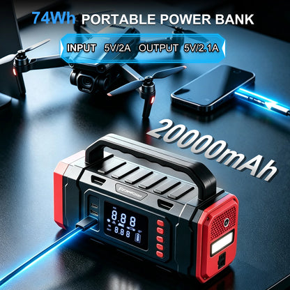 A portable power bank with a digital display screen, red and black body, and a carry handle, shown on a dark reflective surface with a drone, smartphone, and blue light effects. Text overlays read '74Wh PORTABLE POWER BANK', 'INPUT 5V/2A OUTPUT 5V/2.