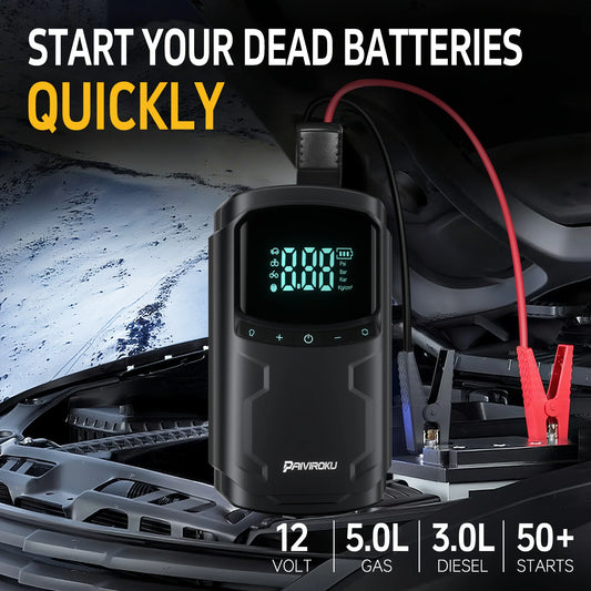 Car battery jump starter with digital display and charging cables, placed inside a car.