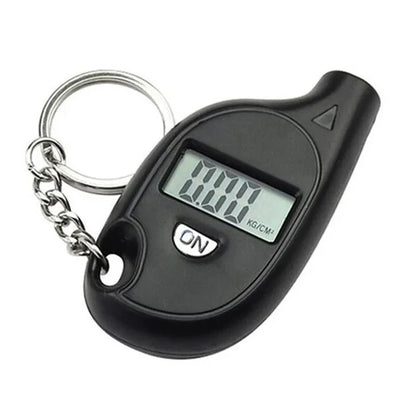 Black digital keychain scale with a digital display on a white background