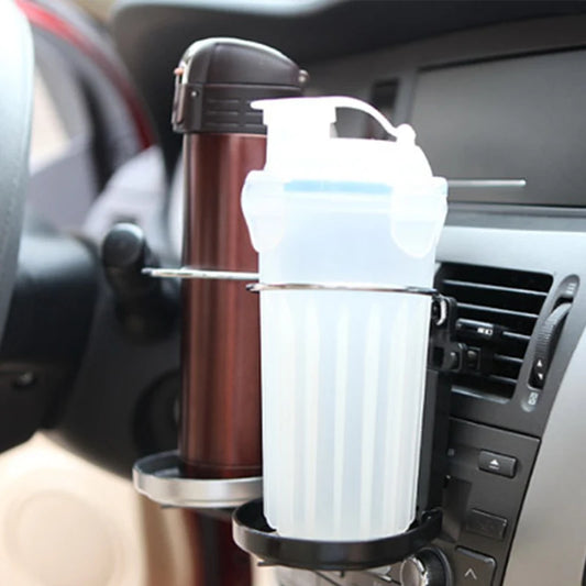 Car cup holder with a thermos and a white container on a car dashboard.