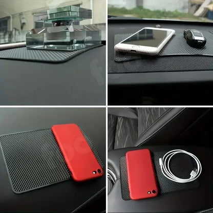 Car dashboard mat with phone, cable, and car key on a black surface