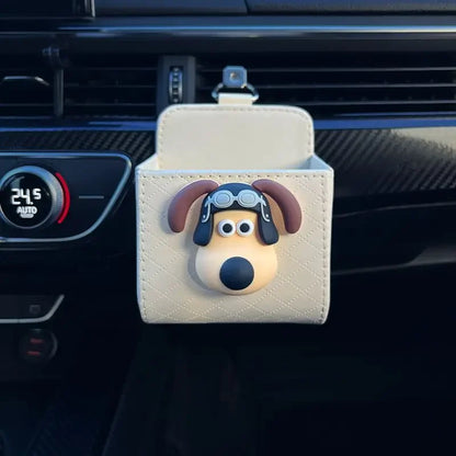 Car organizer with dog design attached to a car's air vent.
