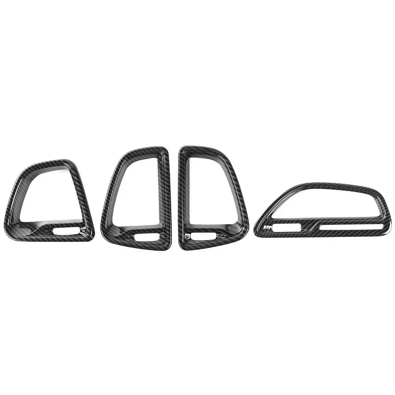 Carbon fiber car door handle covers on a white background