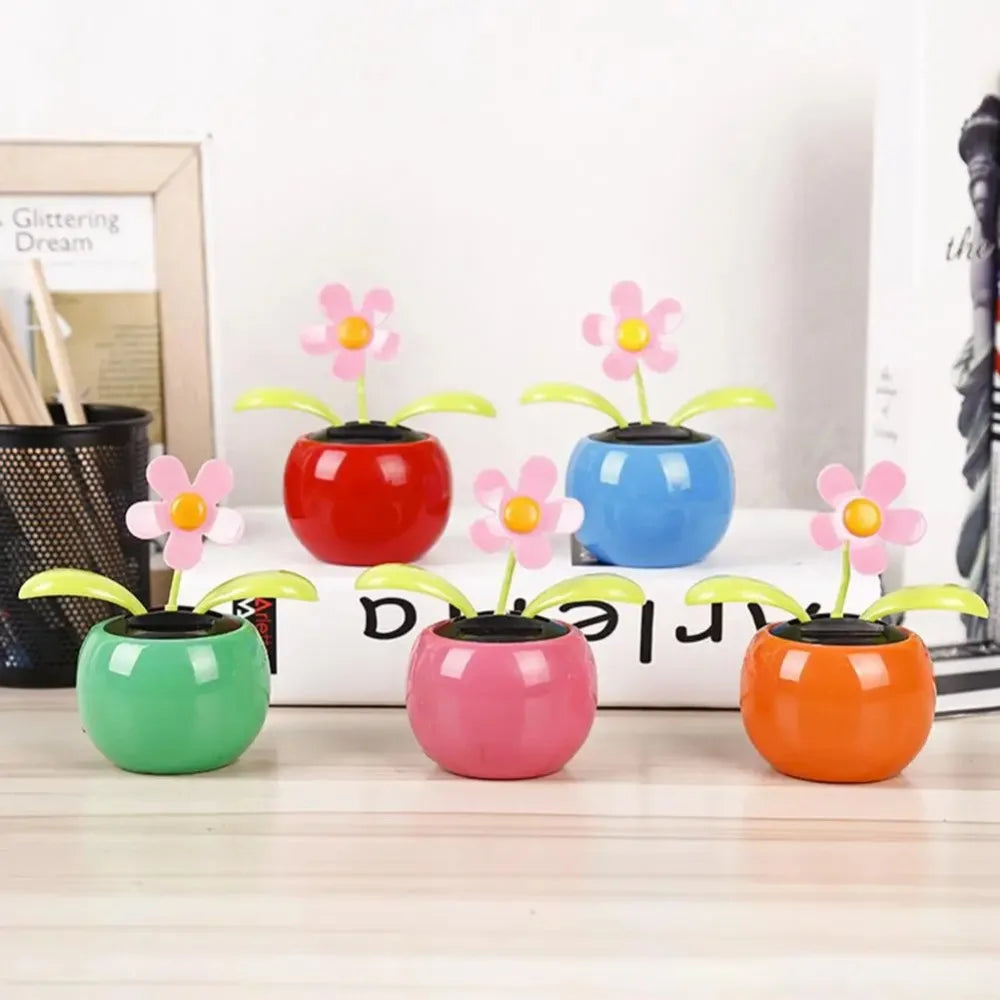 Colorful flower-shaped desk toys on a wooden surface with a blurred background.