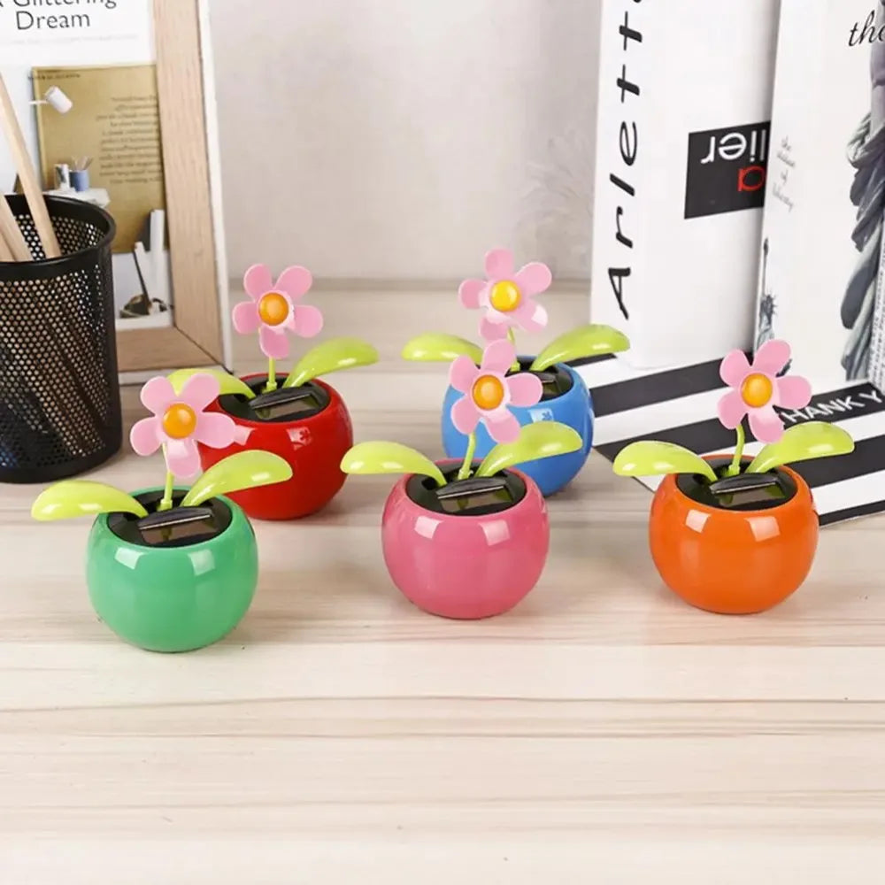 Colorful solar-powered flower toys on a desk