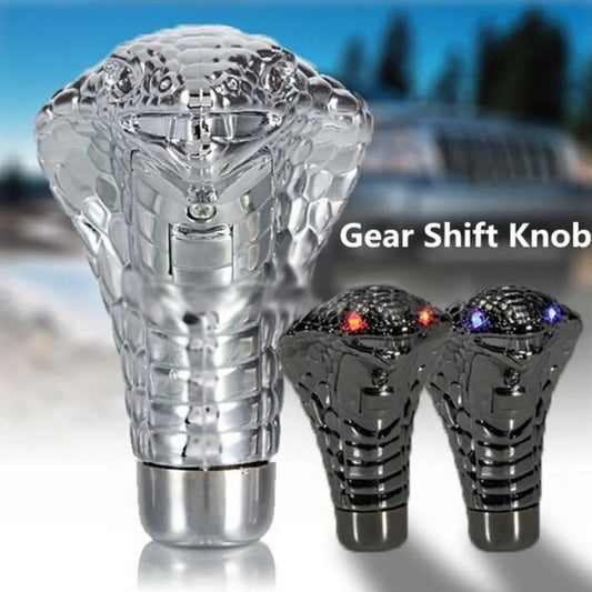 Decorative gear shift knob with LED lights on a blurred vehicle background