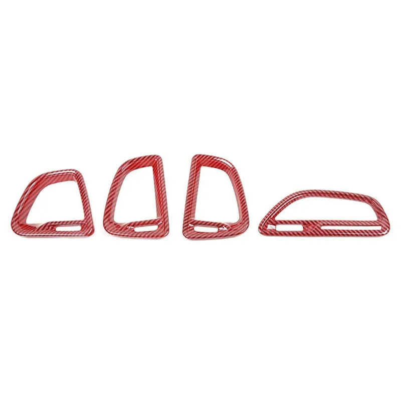 Four red metal stirrups on a white background