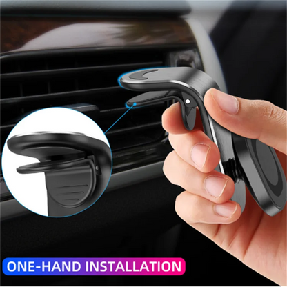 Hand holding a car phone holder with close-up of installation mechanism, set against a car interior background.