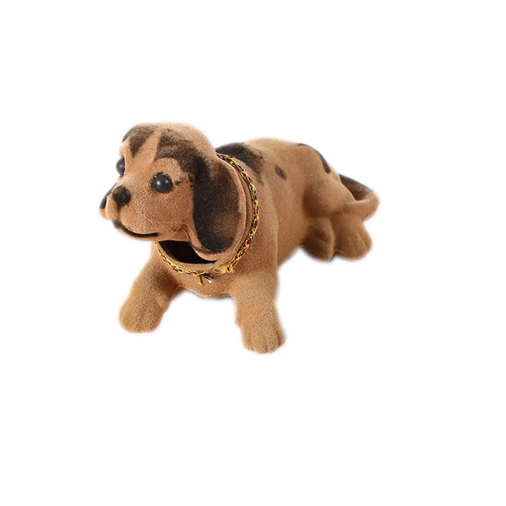 Plush dachshund toy with a gold chain on a white background