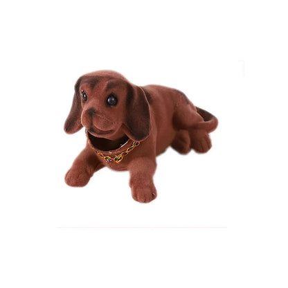 Plush toy dachshund with a gold chain on a white background
