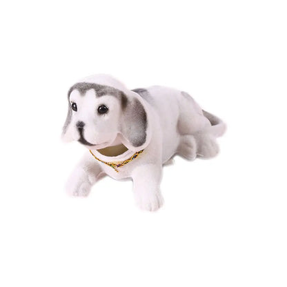 Plush toy dog with a white body and gray patches on a white background
