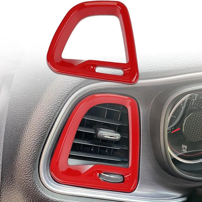 Red car air vent cover on a vehicle dashboard