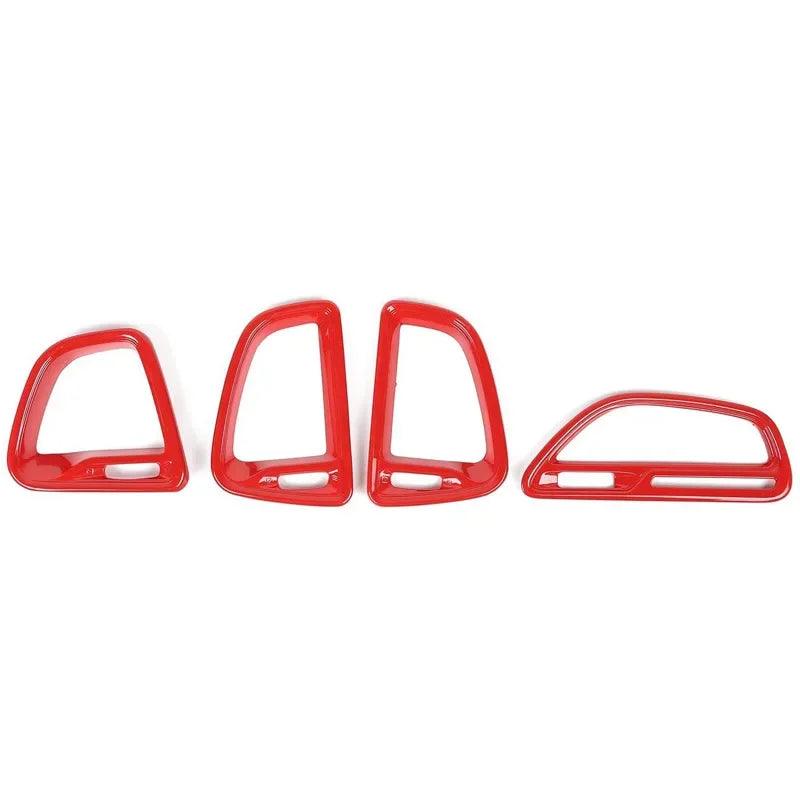 Set of red car interior trim pieces on a white background