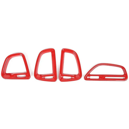 Set of red car interior trim pieces on a white background