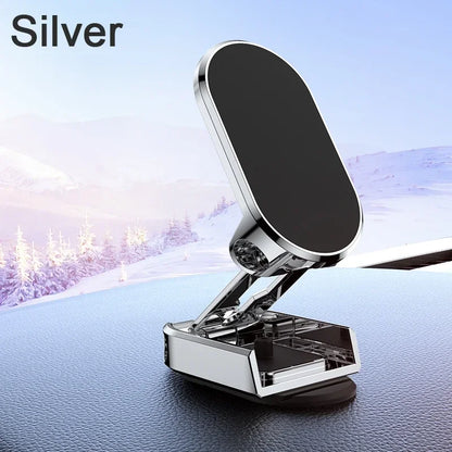 Silver car phone holder on a car dashboard with a snowy landscape in the background