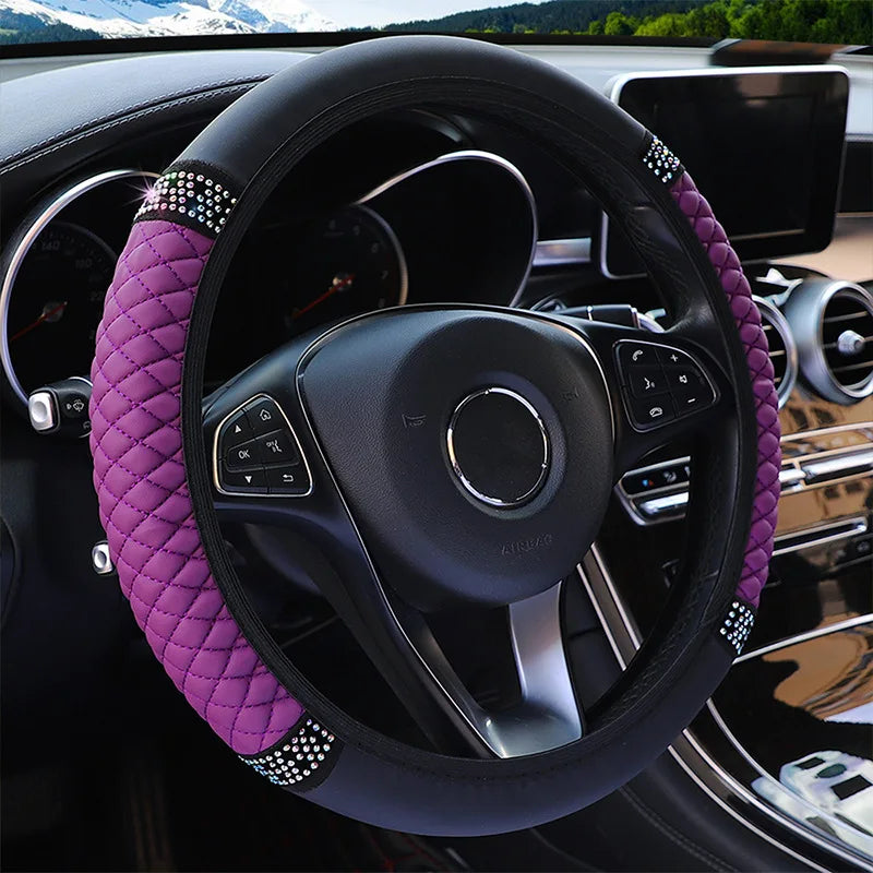Steering wheel with a purple cover in a car interior