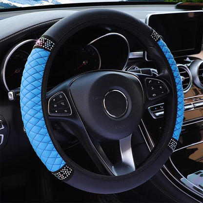 Steering wheel with blue and black cover in a car interior