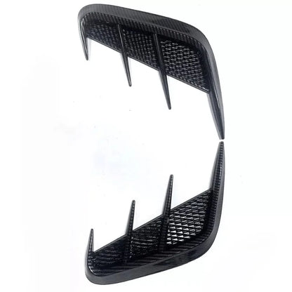 Two black car spoilers on a white background