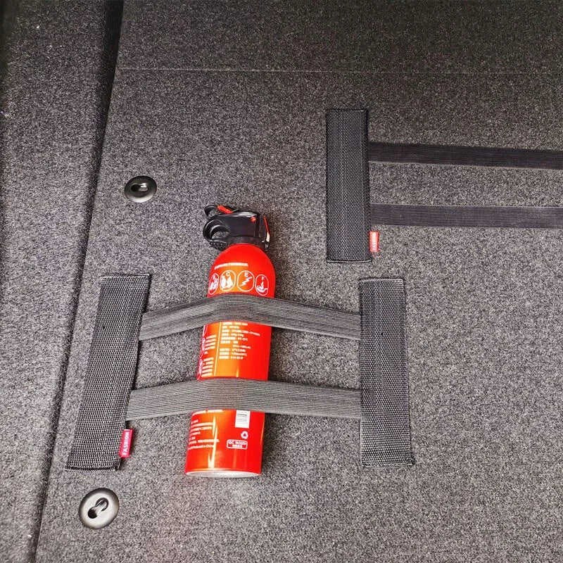 Two red fire extinguishers secured with straps 