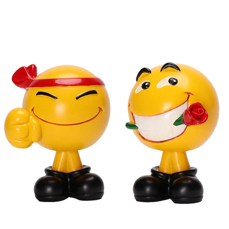 Two yellow character figurines with a red bandana and a rose on a white background