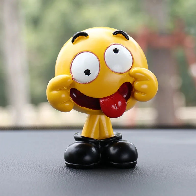 Yellow cartoon character figurine with a surprised expression on a blurred background